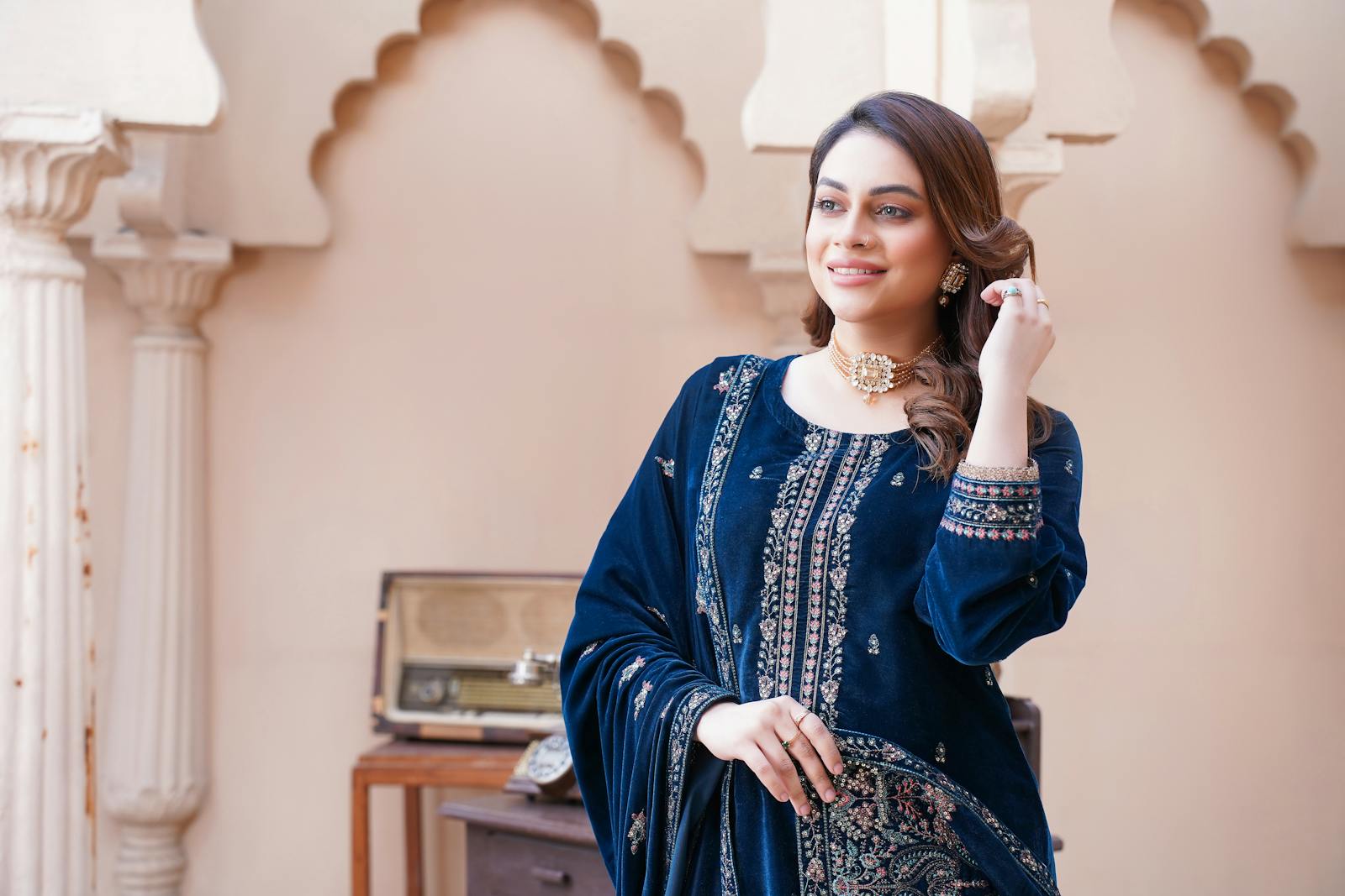 Chic velvet dress fashion shoot featuring a model in Lahore, Pakistan.