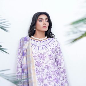 Portrait of a woman in purple and white floral shalwar kameez, outdoors.